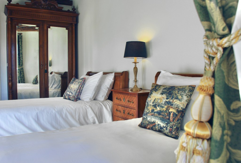 Bedroom 3 Maison Delluc Beynac France- Bedroom 3 with its tall armoire and full-length mirrored doors