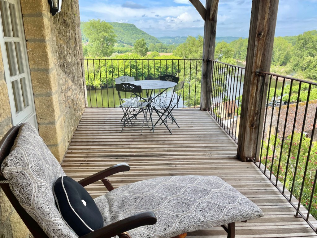 Maison Delluc- The private balcony off bedroom 2 offers two chaise loungers and a bistro table for a relaxing space